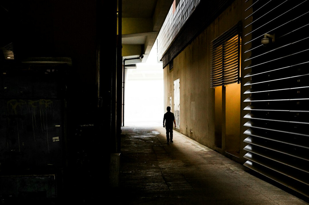 shadowy figure in alley
